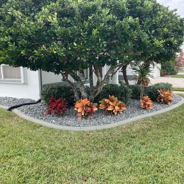 Mulch and rock bed installation in Rockledge, FL for low-maintenance landscaping