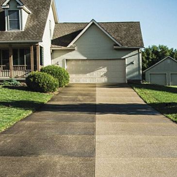Driveway pressure washing in Palm Bay, FL removing oil stains and dirt