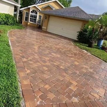 Brick paver driveway installation in Palm Bay, FL with multiple color patterns