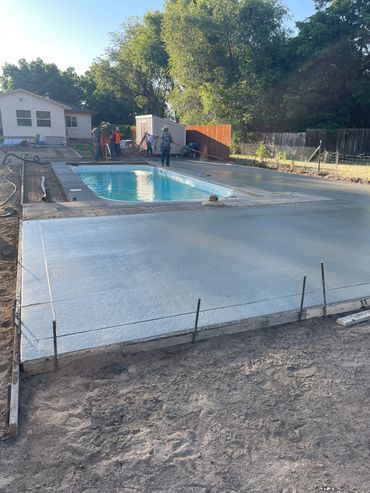 San Juan Fiberglass pools. Dolphin. Adding a large concrete deck for the family to enjoy all season 