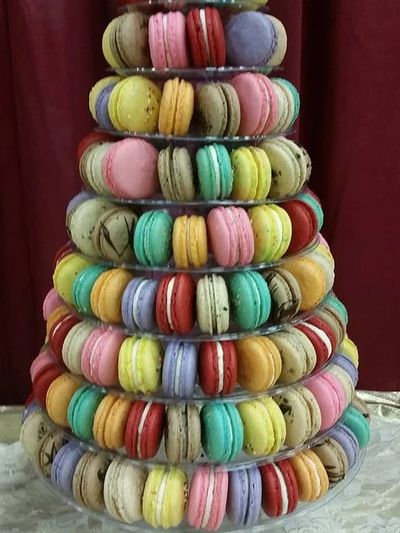 Colorful macarons arranged in a tiered tower display.