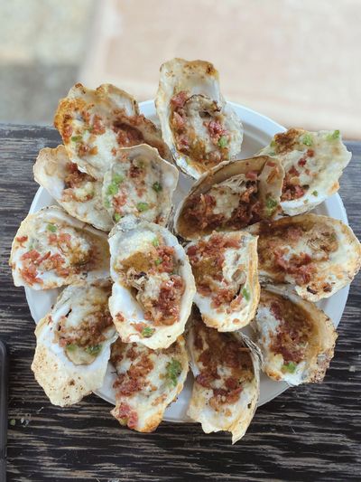 Charbroiled Nomini Bay oysters on a plate