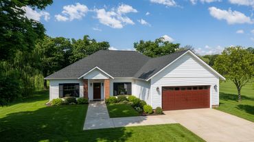A modern single-story house with white siding and a brown garage door.