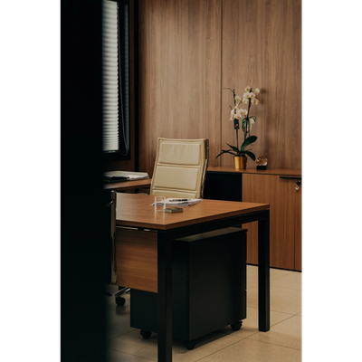 Modern office workspace with wooden furniture and a white chair.
