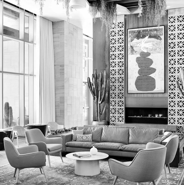Modern living room with leather sofa and art.