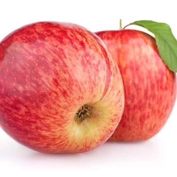 Two fresh red apples with a leaf.