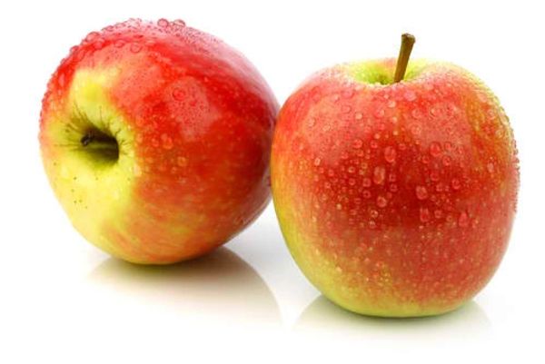 Two fresh red and yellow apples with water droplets on a white background.