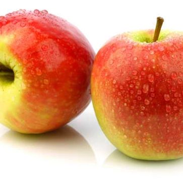 Two red apples with water droplets on them.
