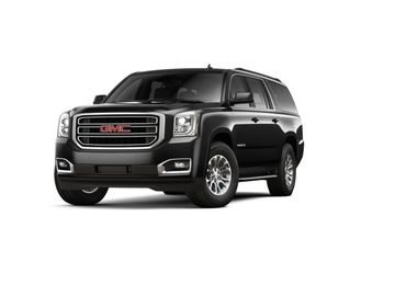 Black GMC SUV parked on white background.