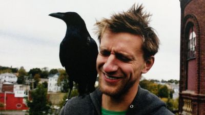 Man with crow, raven on his sholder
