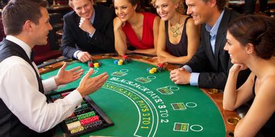 People playing blackjack at a casino table.