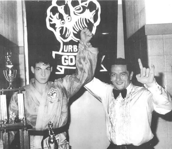 Black and white photo of a martial artist and a man celebrating victory.