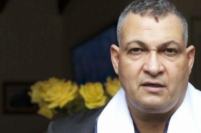 Man with graying hair looking at the camera.