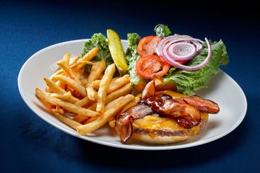 Plate with cheeseburger and fries