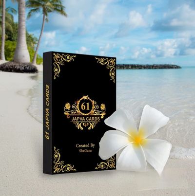 Elegant black box of 61 Japva Cards with a white flower on a beach.