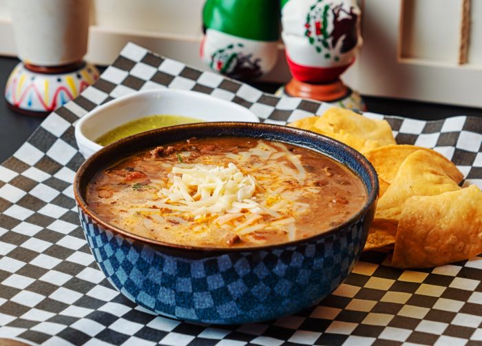 Frijoles charros served with homemade tortilla chips.