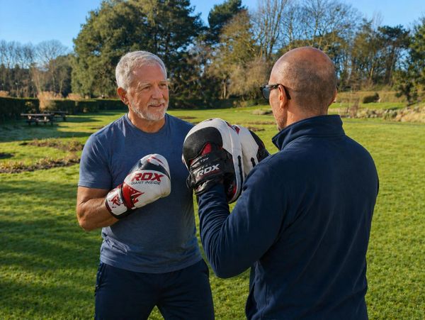 Adapted boxing personal training to improve movement and coordination outdoors.