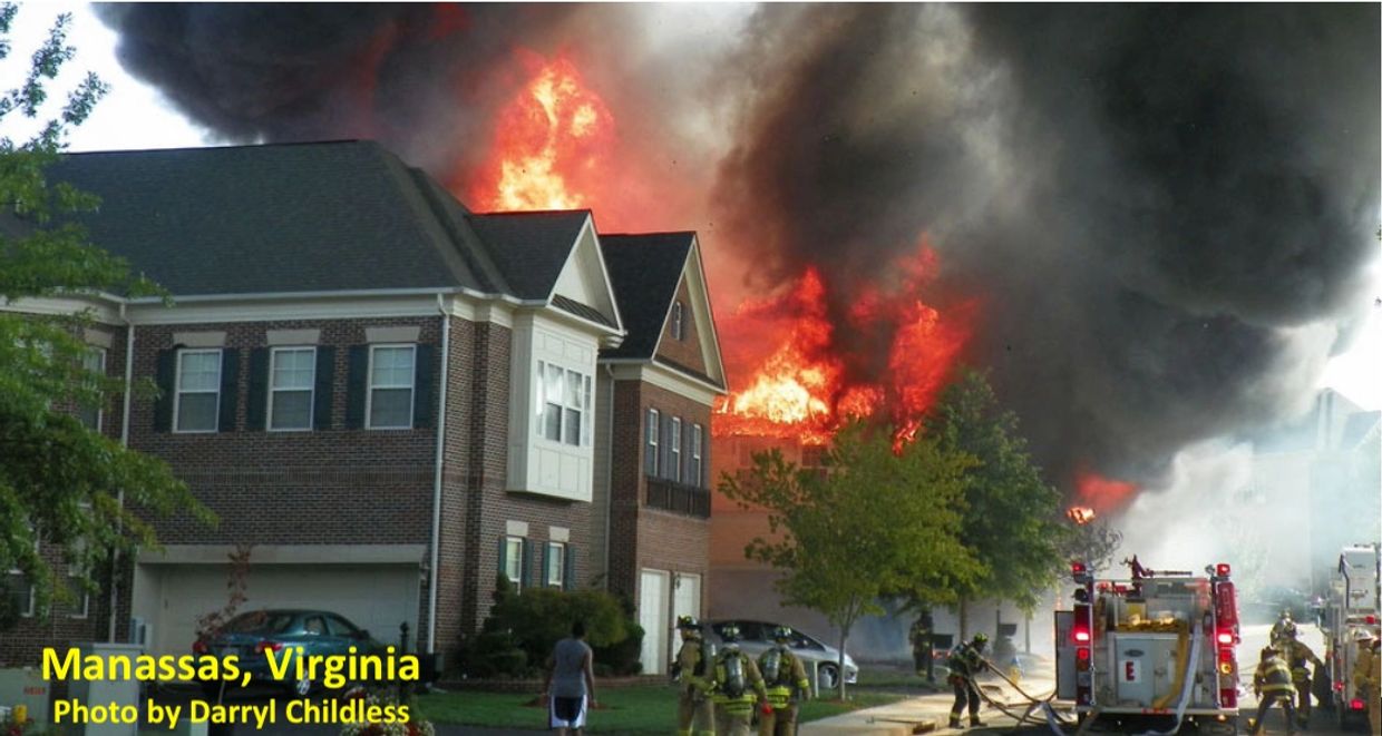 Multiple houses in a residential neighborhood on fire.