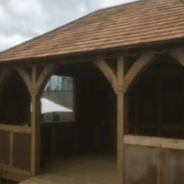 Oak gasebo with an oak shingle roof.