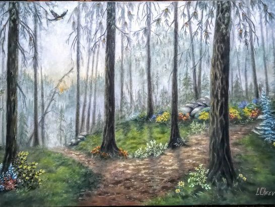 A misty forest path with tall trees and colorful flowers.