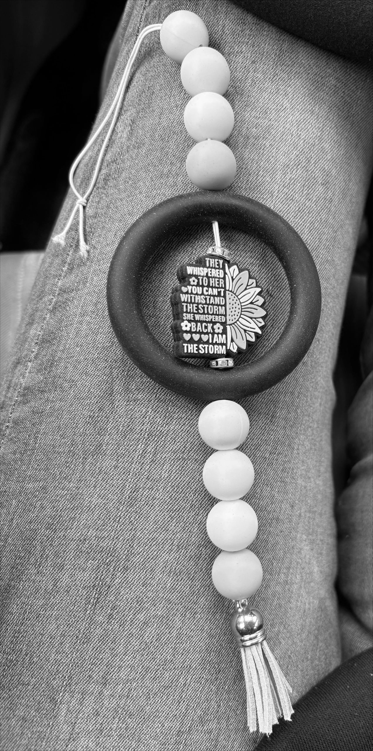 Colorful beaded keychain with empowering quote.