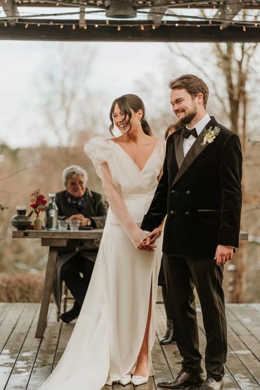 bride and groom smiling during wedding ceremony at The Beacon, Tunbridge Wells 