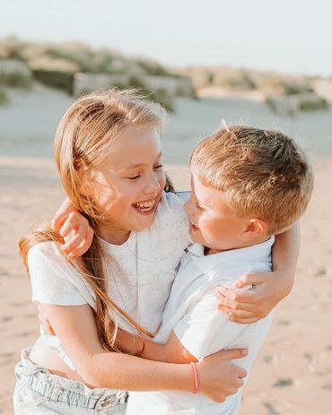 brother and sister hugging