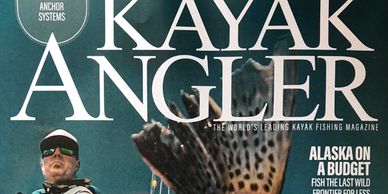 Cover of Kayak Angler magazine featuring a fisherman and a fish tail.
