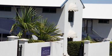 White chapel with a sign reading 'Chapel of the Annunciation'.