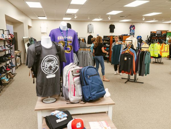 A showroom and store with a range of clothing, accessories and equipment