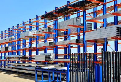 Structural cantilever racking outdoors with a roof to protect product from the elements.