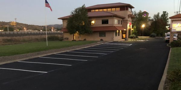 Parking lot striping for business in Roseburg, Oregon over Seal coat 