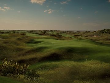 A vast, grassy landscape under a partly cloudy sky.