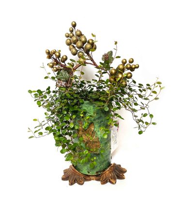 green vase with angel vine wrapping up grape vine