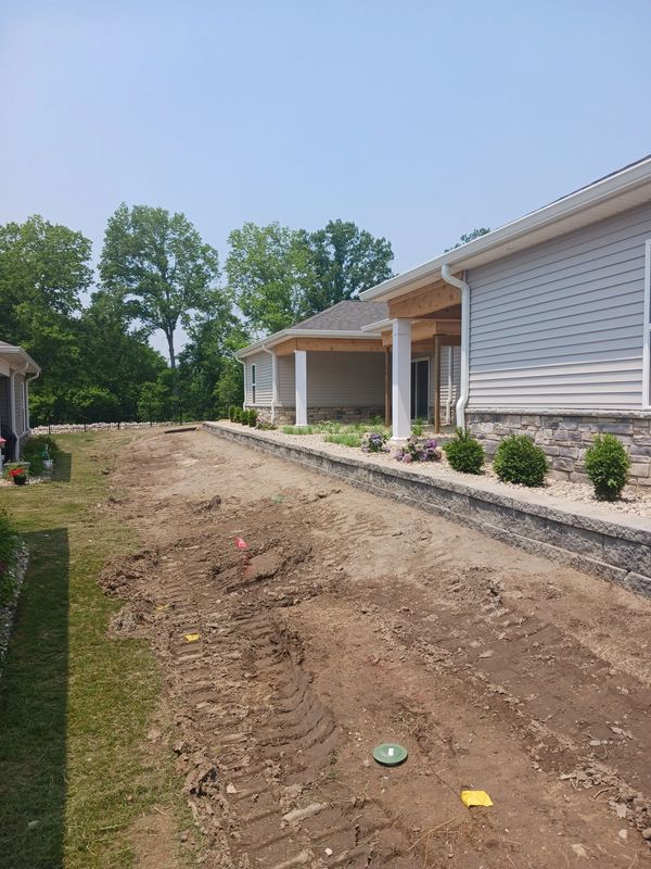 landscape and retaining wall before and after
