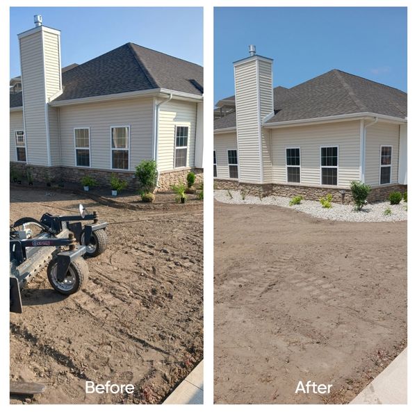 New construction landscape office. Metal edging, river rock and plants