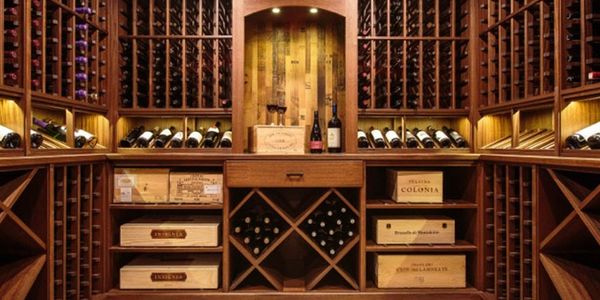 Custom wood wine cellar with solid diamond bins, wood case bins, display angle, and tabletop.