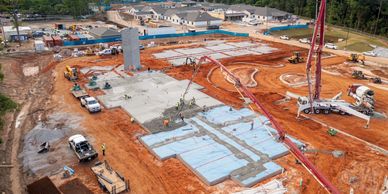 Construction site with foundation work in progress.