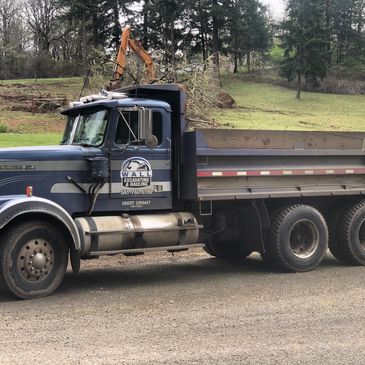 Dump truck with a excavator behind it
hauling and excavation