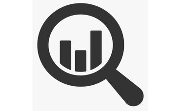 Magnifying glass over bar chart icon.