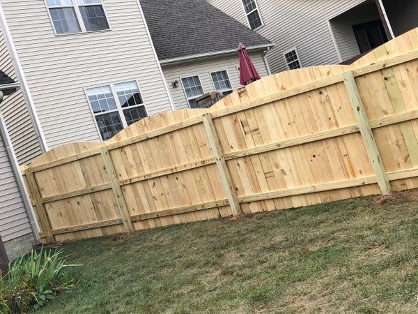 Scallop Fencing on a wood privacy fence in Lexington