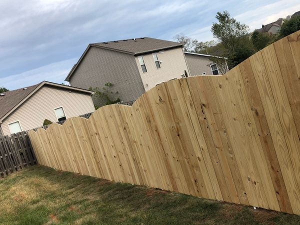 Scallop fencing on a wood privacy fence