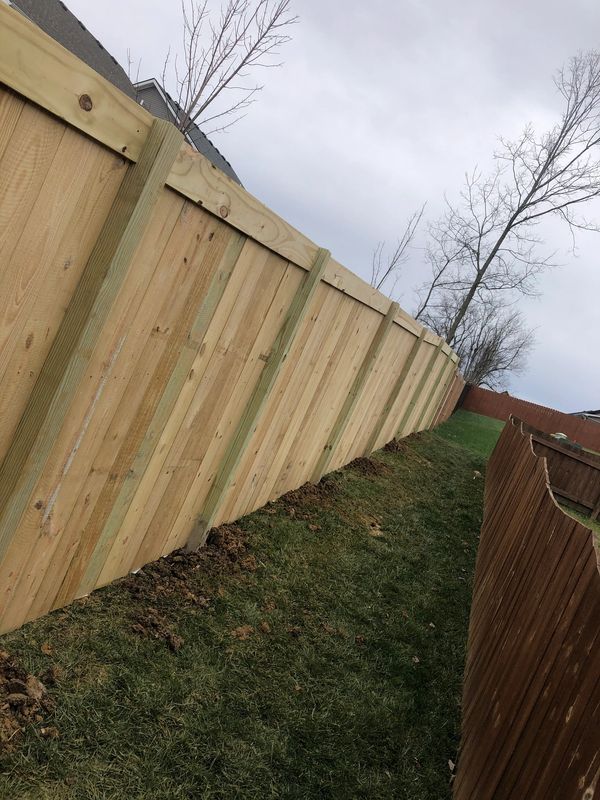 privacy fence with a top running board installation for residential area near Lexington, Kentucky