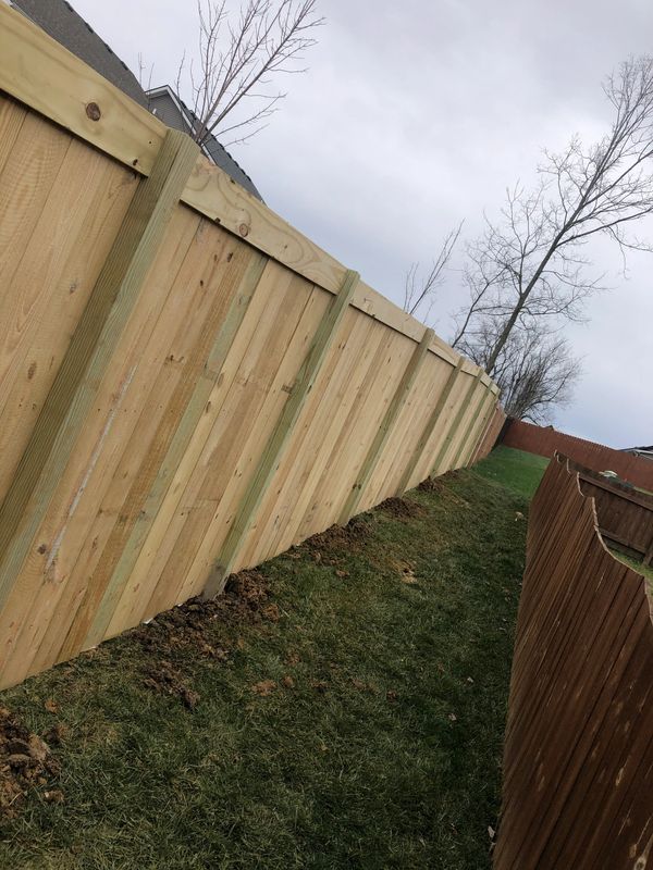 privacy fence with a top running board