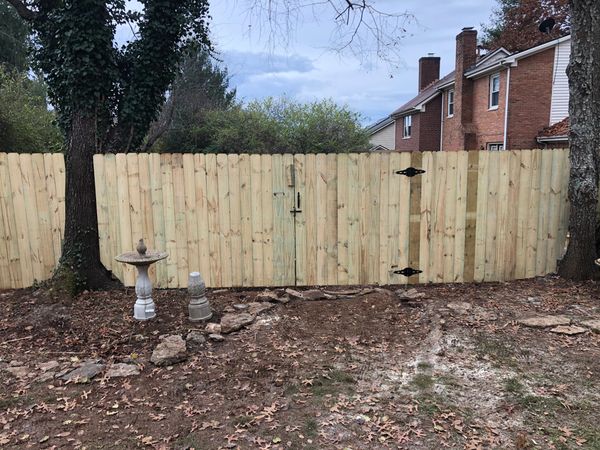 wood privacy fence with a wood gate in Lexington, Kentucky