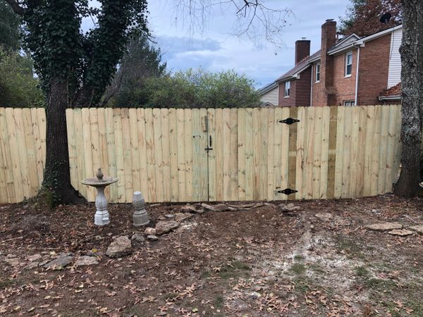 wood fence with a wood gate in Lexington