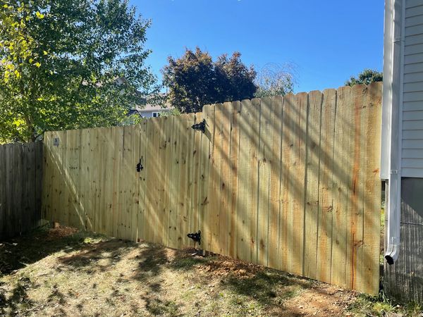 Wood fence install with a gate install for home near Lexington, Kentucky
