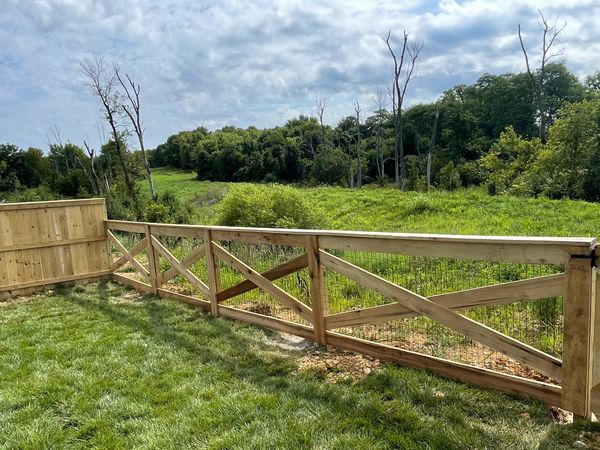 Wooden gate with design installed on property near Lexington, Ky