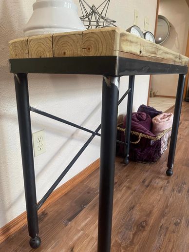 Wrought iron accent or sofa table with flat black finish and wood top. 