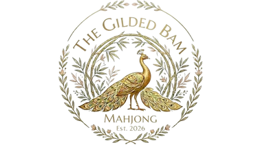 Elegant gold peacock emblem with laurel wreath and text.